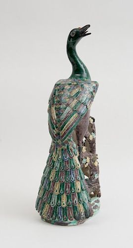 CHINESE POLYCHROME-GLAZED PORCELAIN FIGURE OF A PEACOCK