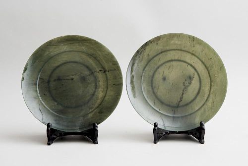 PAIR OF CHINESE SPINACH GREEN JADE FOOTED PLATES