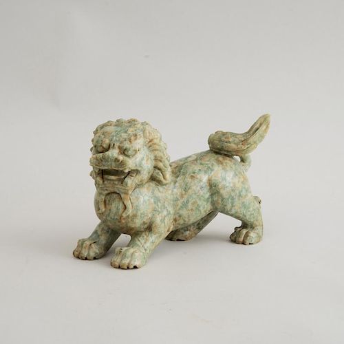 CHINESE CARVED SPECKLED GREEN JADE FIGURE OF A FU DOG