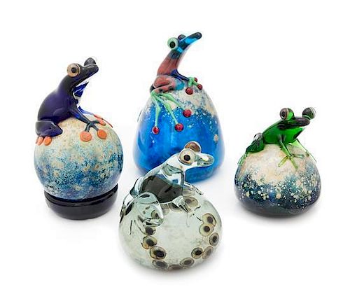 * John Nygren, (American), a group of four paperweights, each with applied frog decoration