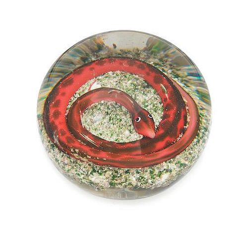 * Attributed to Baccarat, , a snake on rock ground paperweight