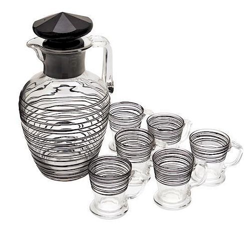 Steuben, , a black threaded-glass water pitcher with 6 small cups