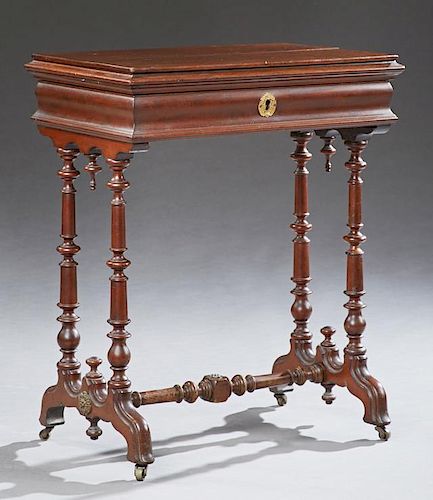 English Carved Mahogany Work Table, 19th c., the stepped sloping hinged top opening to an inset mirror and compartmentalized 