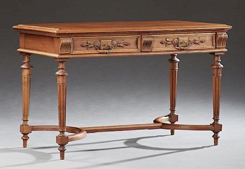 French Louis Philippe Style Carved Walnut Writing Table, c. 1860, the stepped rectangular top over two relief carved drawers 