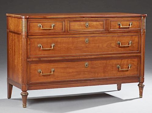 French Louis XVI Style Carved Cherry Commode, early 20th c., the rectangular ogee edge cookie corner top over three frieze dr