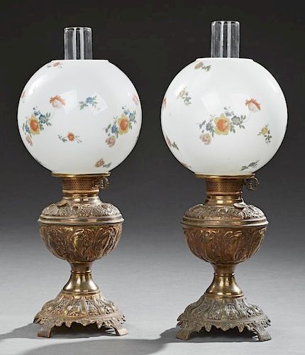 Pair of Brass Gone with the Wind Oil Lamps, late 19th c., with floral painted ball shades and glass chimneys, now electrified
