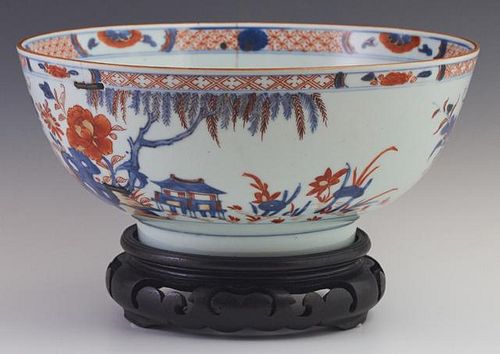 Chinese Imari Style Porcelain Bowl, 19th c., with floral and pagoda decoration, in orange and blue, with an old stapled repai
