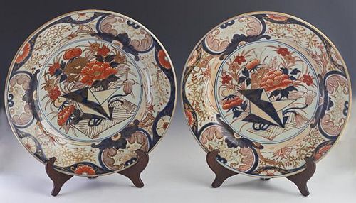 Pair of Large Imari Porcelain Chargers, late 19th c., with floral decoration in the typical Imari gilt, orange and blue palet