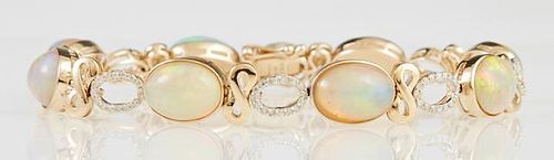 14K Yellow Gold Link Bracelet, the eight oval links with a cabochon opal, joined by pierced diamond mounted oval links border
