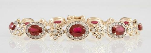 14K Yellow Gold Link Bracelet, each of the nine oval links with a graduated oval ruby atop a border of round diamonds, joined