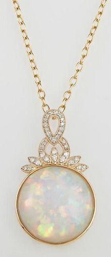 14K Yellow Gold Pendant, with a 19.04 carat round cabochon opal within a gold border, with a pierced diamond mounted oval and