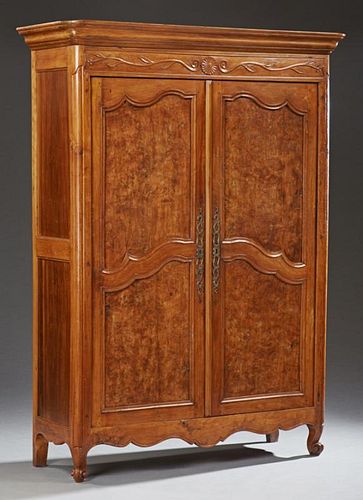 Louis XV Style Carved Cherry Armoire, early 19th c., the rounded edge ogee crown double fielded panel burled elm doors, on ca