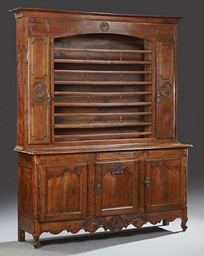 French Louis XV Style Carved Oak Vaisselier, 19th c., the stepped crown over central plate rails flanked by cupboard doors, s