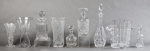 Group of Nine Pieces of Cut Crystal, 20th c., consisting of five decanters and stoppers, three vases, and an ice bucket (9 Pc