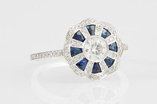 Lady's 18K White Gold Floriform Dinner Ring, with a central .39 carat round diamond within diamond mounted spokes separated b