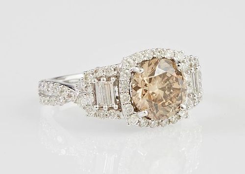 Lady's 18K White Gold Dinner Ring, with a round 2.01 carat fancy brown diamond within a border of round diamonds, with diamon