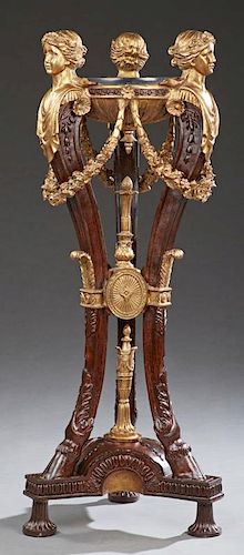 Classical Style Marble Top Gilt and Mahogany Pedestal, 20th c., the circular black marble top within three figural supports w