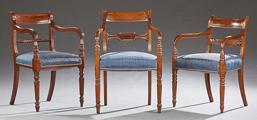 Group of Three English Carved Regency Armchairs, 19th c., one with a curved back over a pierced horizontal splat to curved ar