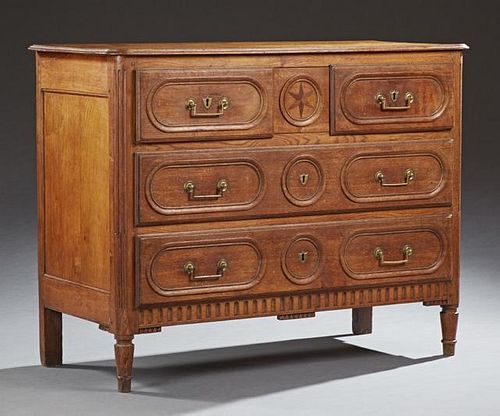 French Louis XVI Style Inlaid Carved Oak Commode, 19th c., the stepped rounded corner top over two frieze drawers above two d