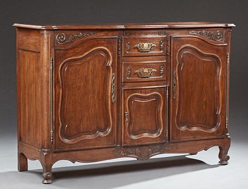 French Louis XV Style Carved Oak Bowfront Sideboard, 20th c., the serpentine ogee edge parquetry inlaid rectangular top over 