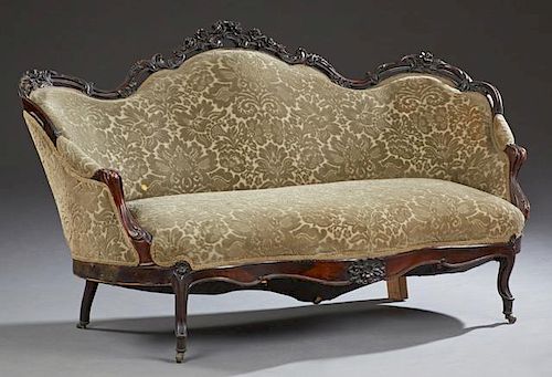 American Rococo Revival Carved Rosewood Settee, 19th c., possibly New Orleans, with a serpentine pierced floral carved crest 