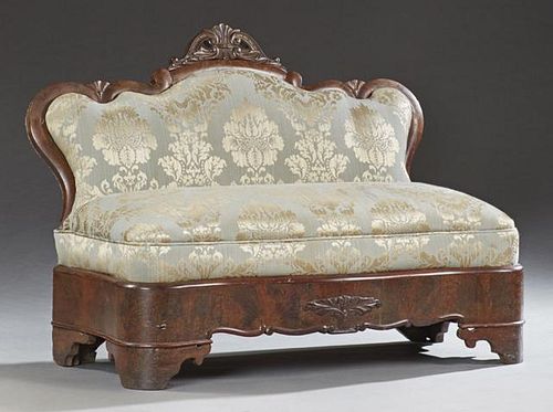 American Victorian Carved Mahogany Window Seat, 19th c., the serpentine top with a pierced crest over an upholstered back to 