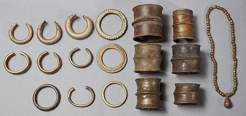 Group of Seventeen Pieces of African Bronze Jewelry, 20th c., consisting of six wide cuff bracelets, ten bangle bracelets, an