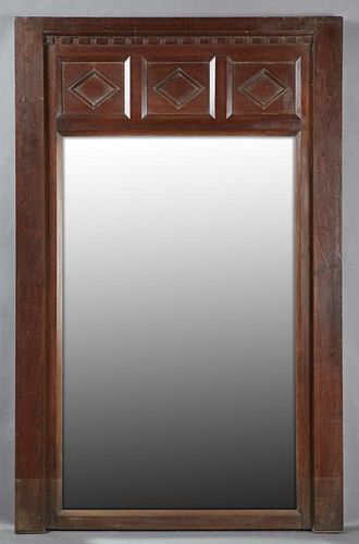 French Carved Walnut Overmantle Mirror, 20th c., the top with a dentillated and diamond carved panel over a rectangular wide 