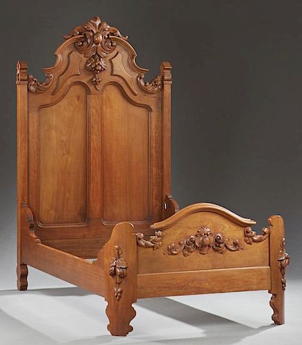 American Carved Walnut Highback Single Bed, 19th c., probably Mitchell and Rammelsberg, Cincinnati, the arched high back with