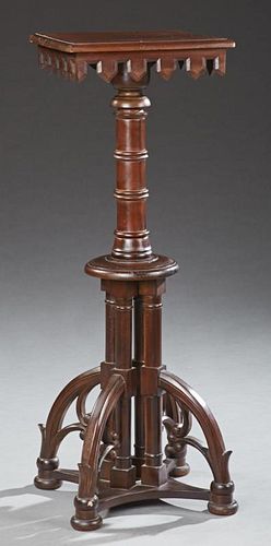 American Victorian Carved Mahogany Pedestal, early 20th c., the stepped dentillated top on turned support to four curved legs
