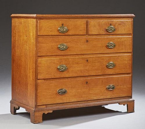 English Georgian Carved Mahogany Chest, 19th c., the rectangular top over two frieze drawers above three graduated long drawe