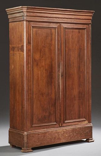 American Pine Armoire, 19th c., possibly New Orleans, the stepped ogee crown above two paneled doors, on a plinth base with a