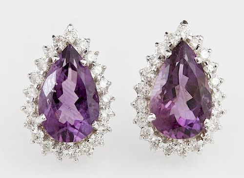 Pair of 14K White Gold Earrings, each with a 5.19 carats pear shaped amethyst atop a conforming border of round diamonds, tot