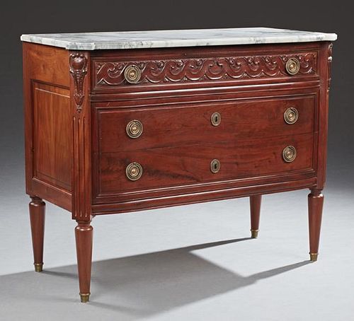 French Louis XVI Style Carved Mahogany Marble Top Bowfront Commode, 19th c., the stepped ogee edge block corner figured white