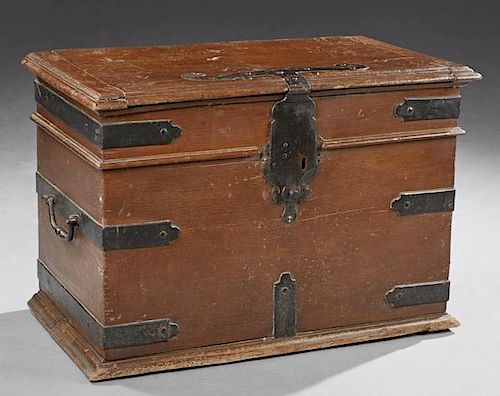 Carved Oak Iron Mounted Strong Box, 19th c., the rectangular hinged lid over the iron banded case flanked by iron handles and