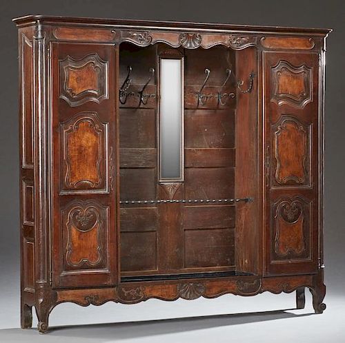French Louis XV Style Carved Cherry and Elm Hall Stand, 19th c., the stepped ogee edge crown over a center with wrought iron 