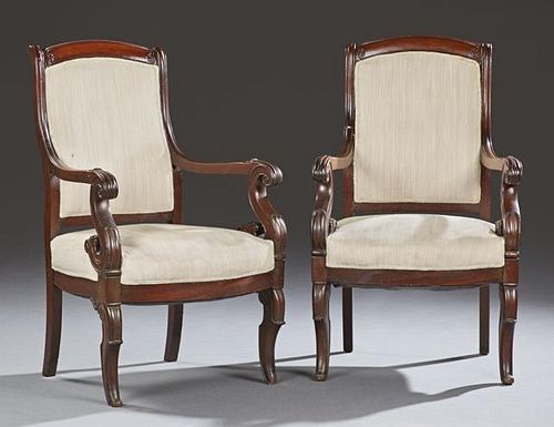 Pair of Empire Style Carved Mahogany Fauteuils, 19th c., the arched curved crest rails over an upholstered back to an upholst
