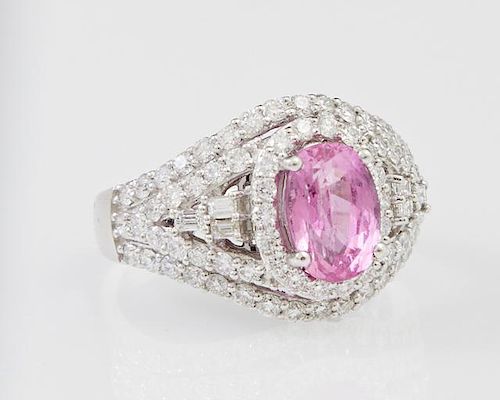Lady's Platinum Dinner Ring, with an oval 2.39 carat pink sapphire atop a border of small round diamonds, supported by round 