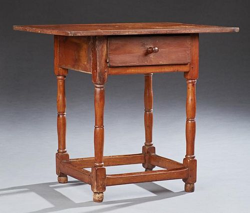 American Primitive Side Table, 19th c., the rectangular top over a deep drawer on turned tapered legs joined by a box stretch