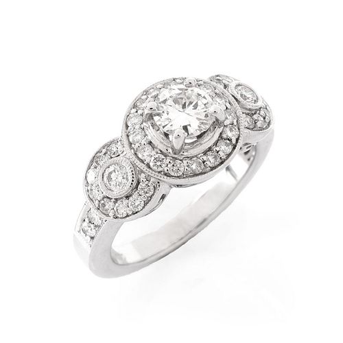 Approx. 1.40 Carat Diamond and 18 Karat White Gold Engagement Ring. Set in the center with a round 