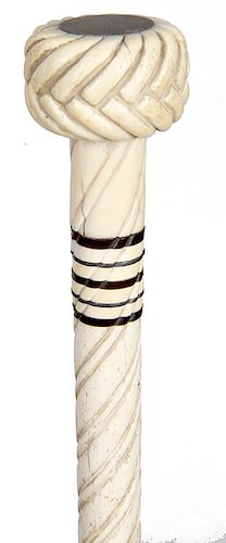 3. Whale Bone cane ca. 1865 – A carved whale bone handle with a silver disc atop, five baleen spacers, 7/8” shaft which is half spiral carved and a br