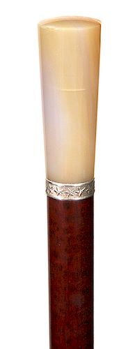 72. Hardstone Dress Cane- Ca. 1900- A grayish brown agate handle, silver collar with high relief stars, snakewood shaft and a horn ferrule. H.- 2 ¼” x