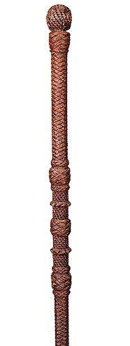82. Dual Purpose Macramé Cane- Ca. 1880- Dual purpose that doubles as a defensive cane finely woven throughout with various collars and chains, fine c