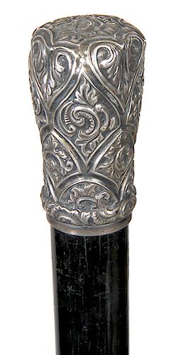 91. Telescope Cane- Ca. 1885- A quality telescope cane with an ornate silver handle which unscrews from the ebonized shaft to produce a 13 ½” brass on