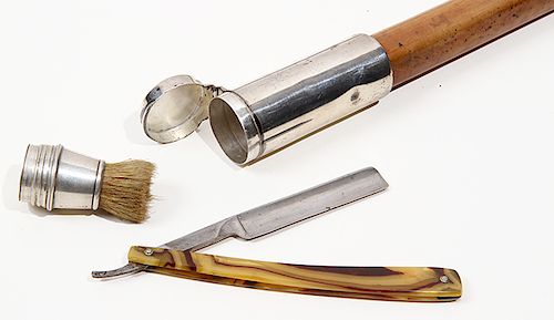 108. Shaving Kit System Cane- Late 19th Century- A British “Drew & Son” coin silver compartment cane which houses a horse hair shaving brush and strai