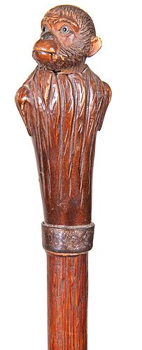 114. Automaton Monkey Cane- Ca. 1880- A wonderful example of a Black Forrest or Bavarian carved cane handle of a monkey with two color glass eyes and 