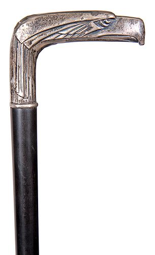 126. Silver Eagle Dress Cane- Early 20th Century- A stylized .800 silver eagle handle with a registration mark of “#8692 KHN”, the thumb rest on the n
