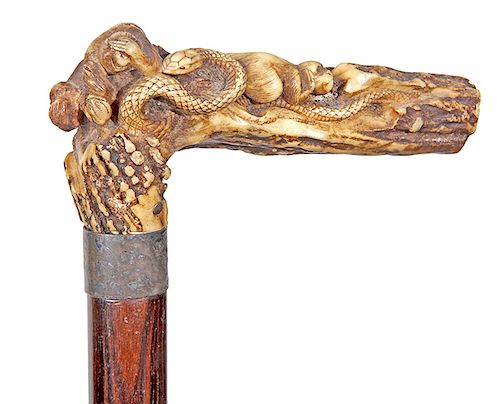 147. Japanese Monkey Cane- Ca. 1890s- pair of whimsical monkeys playing with a snake on a large carved log, nice long carved stag handle with original