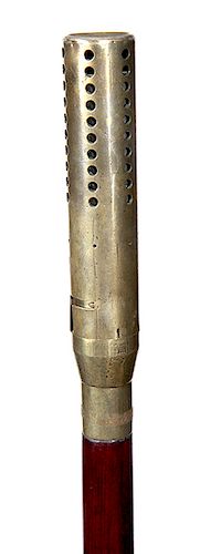 154. Torch System Cane- early 20th century- a kerosene torch cane with a reservoir within the shaft, the brass handle interlocks with a brass collar, 