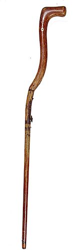 166. Days Patent Under Hammer Gun Cane- Mid 19th Century- A .54 caliber percussion gun cane in working condition, wood stock with a pair of silver eye